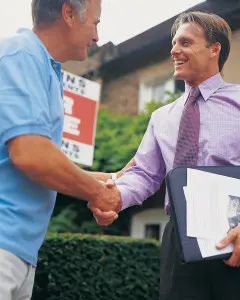 Man shaking hands with property manager